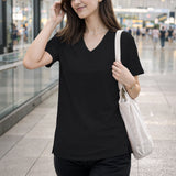 Black Women’s Stretch Performance T-Shirt on a model – Lux Decor
